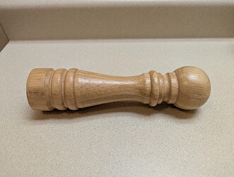 It looks like a giant pawn...or a flashlight