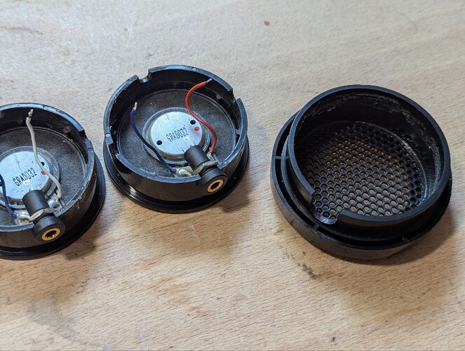 The new receptacles in place, hole in the shell filed larger