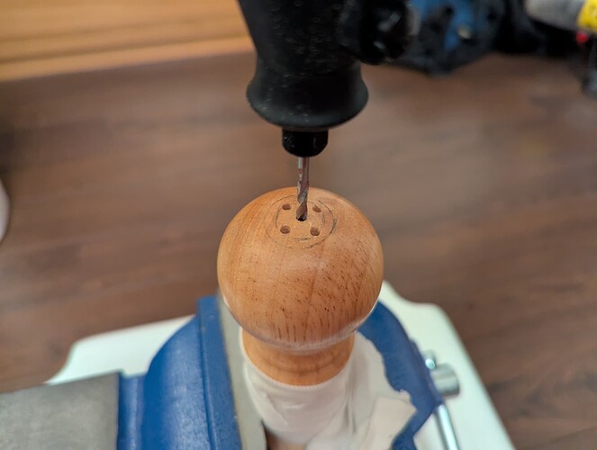 Initially widening the hole with a drill