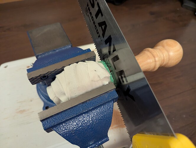 Sawing on my makeshift workbench...