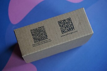 Side of the packaging with QR codes to Sofirn storefronts